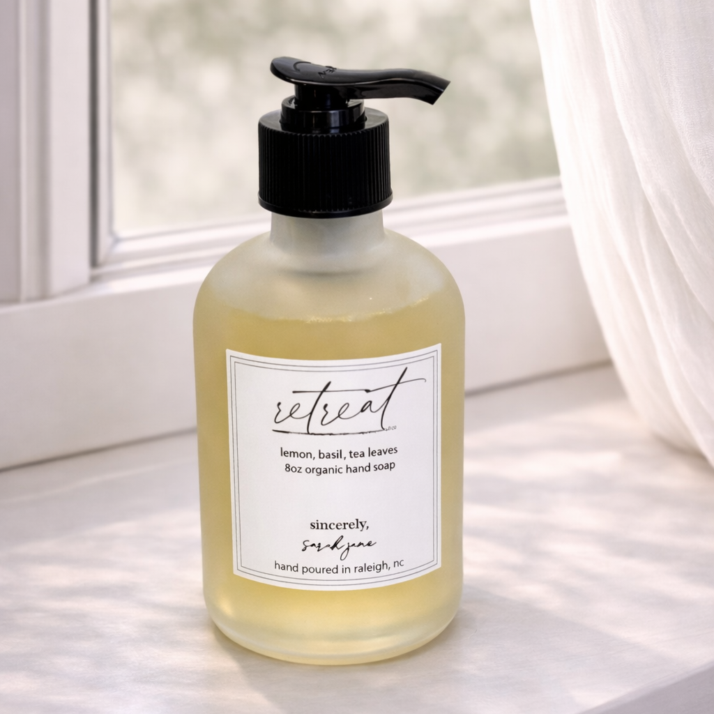 Hand soap bottle with pump on a windowsill