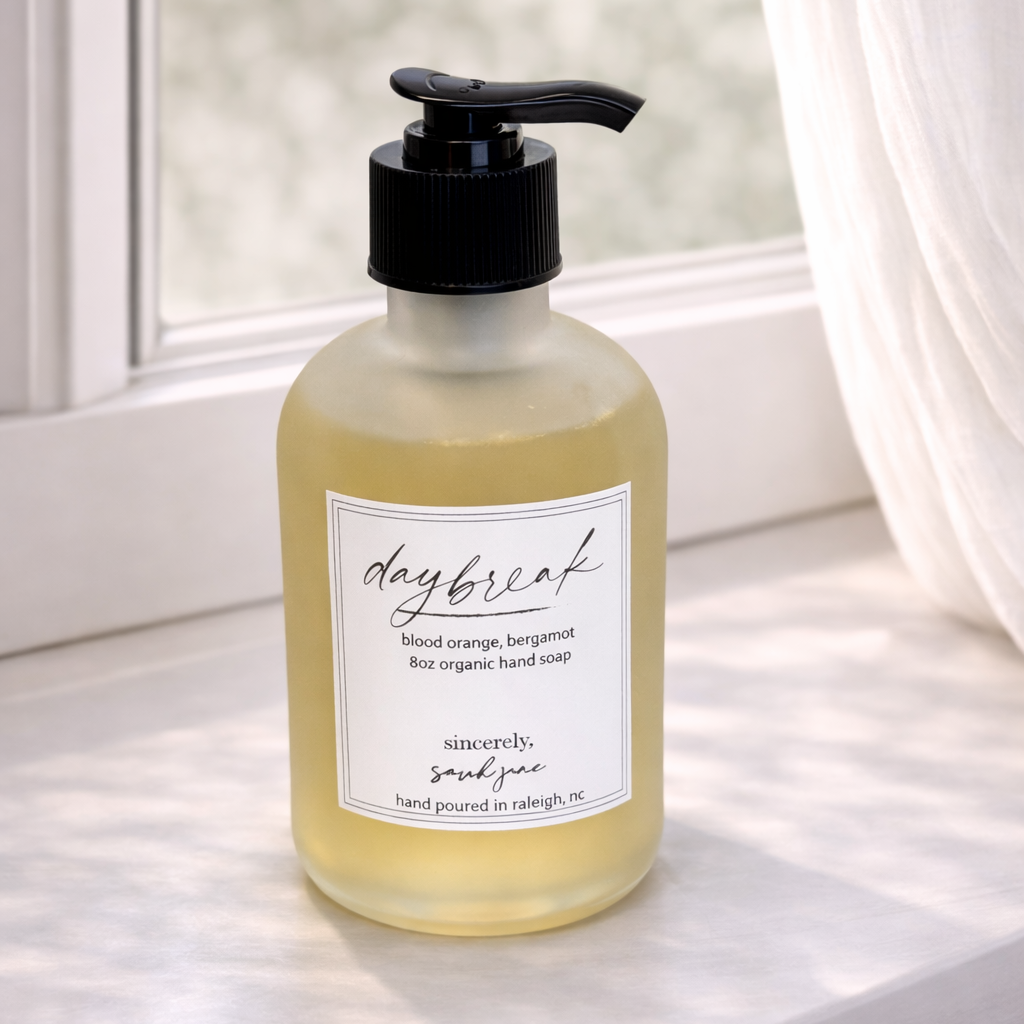 Hand soap bottle with pump on a windowsill