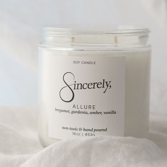 Scented candle labeled 'Sincerely' on a light background