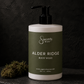 Body wash bottle labeled 'Alder Ridge' by 'Sincerely, Man' on a dark surface with a dark background.