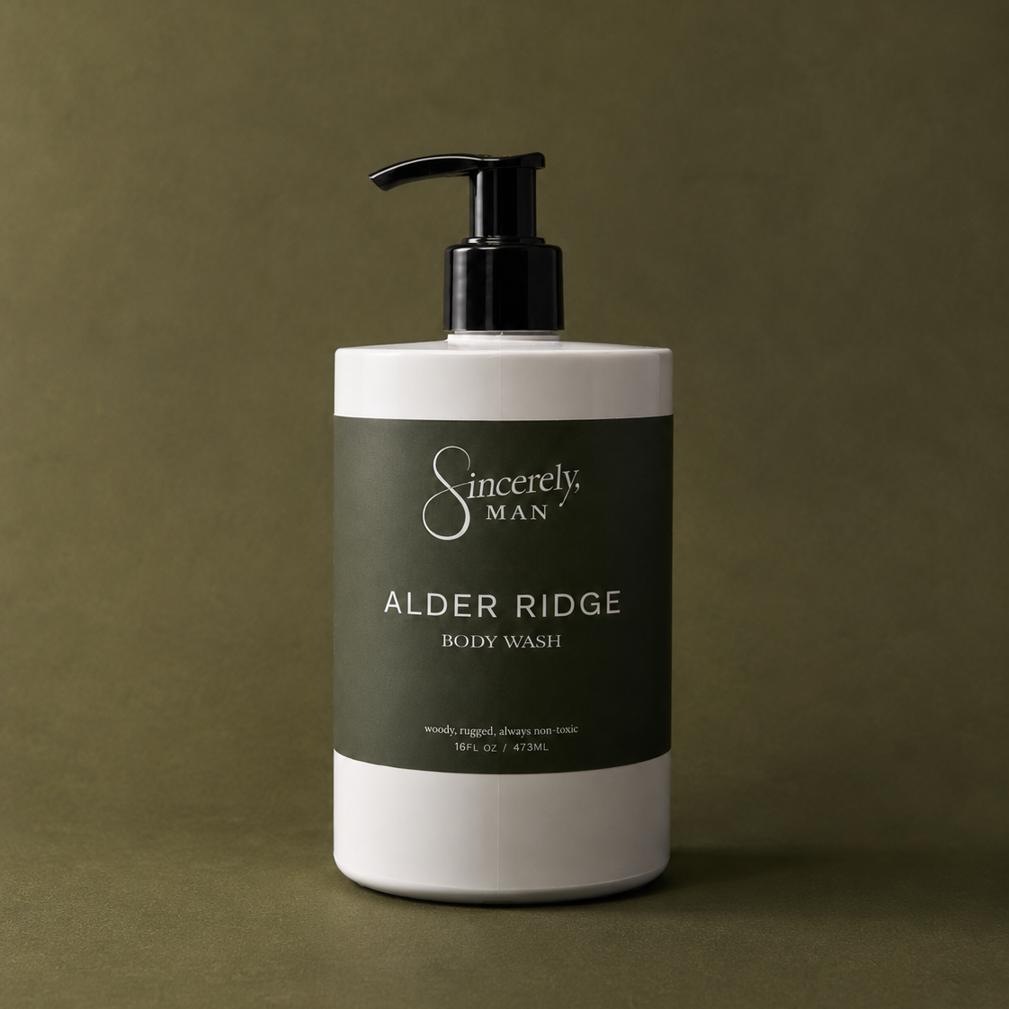 Body wash bottle labeled 'Alder Ridge' by 'Sincerely, Man' on a brown background