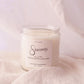 Candle labeled 'Sincerely' on a soft pink background
