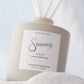 Reed diffuser labeled 'Sincerely' with 'Cove' fragrance on a light background