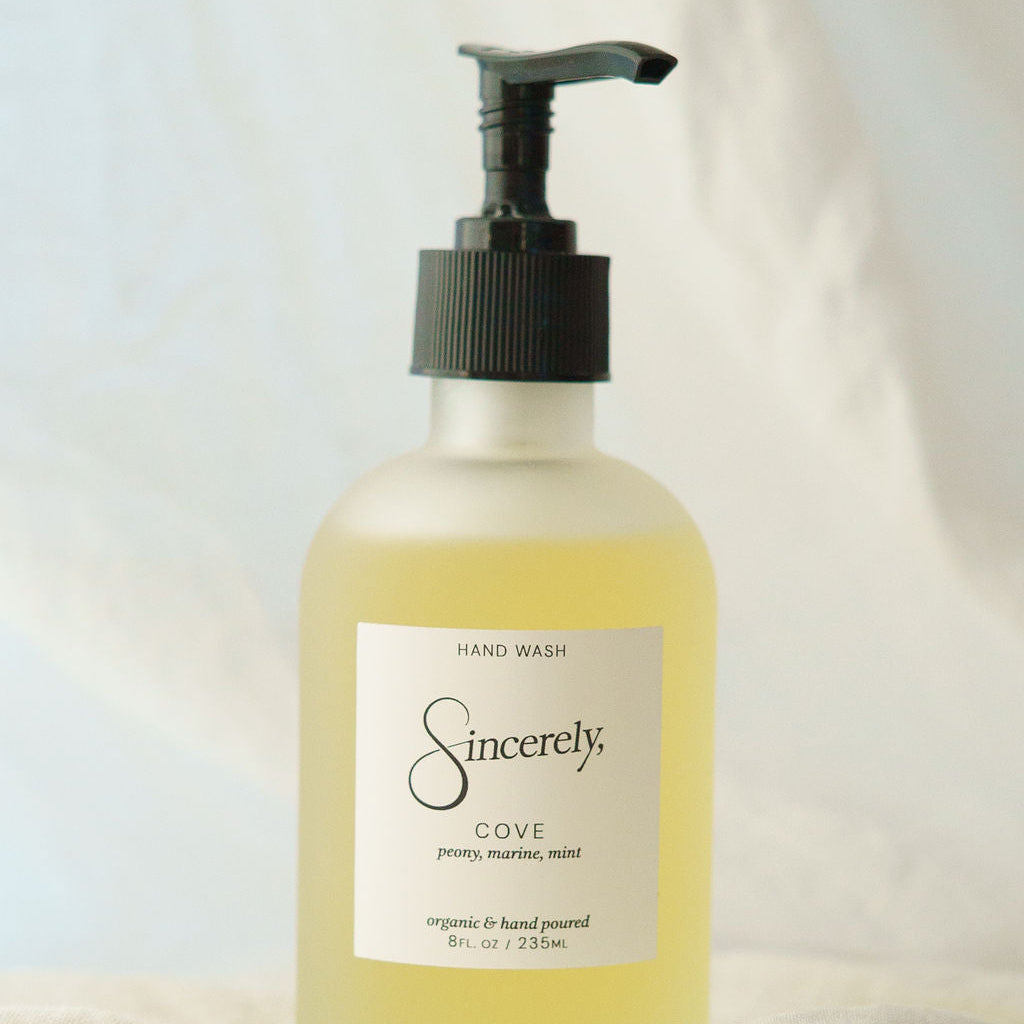 Hand wash bottle labeled 'Sincerely, Cove' on a light background