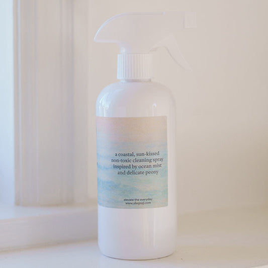 White bottle with a label on a white surface