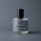 Perfume bottle labeled 'Sincerely, Man Monaco' on a gray background