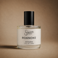 Perfume bottle labeled 'Sincerely, Man Roanoke' on a brown background