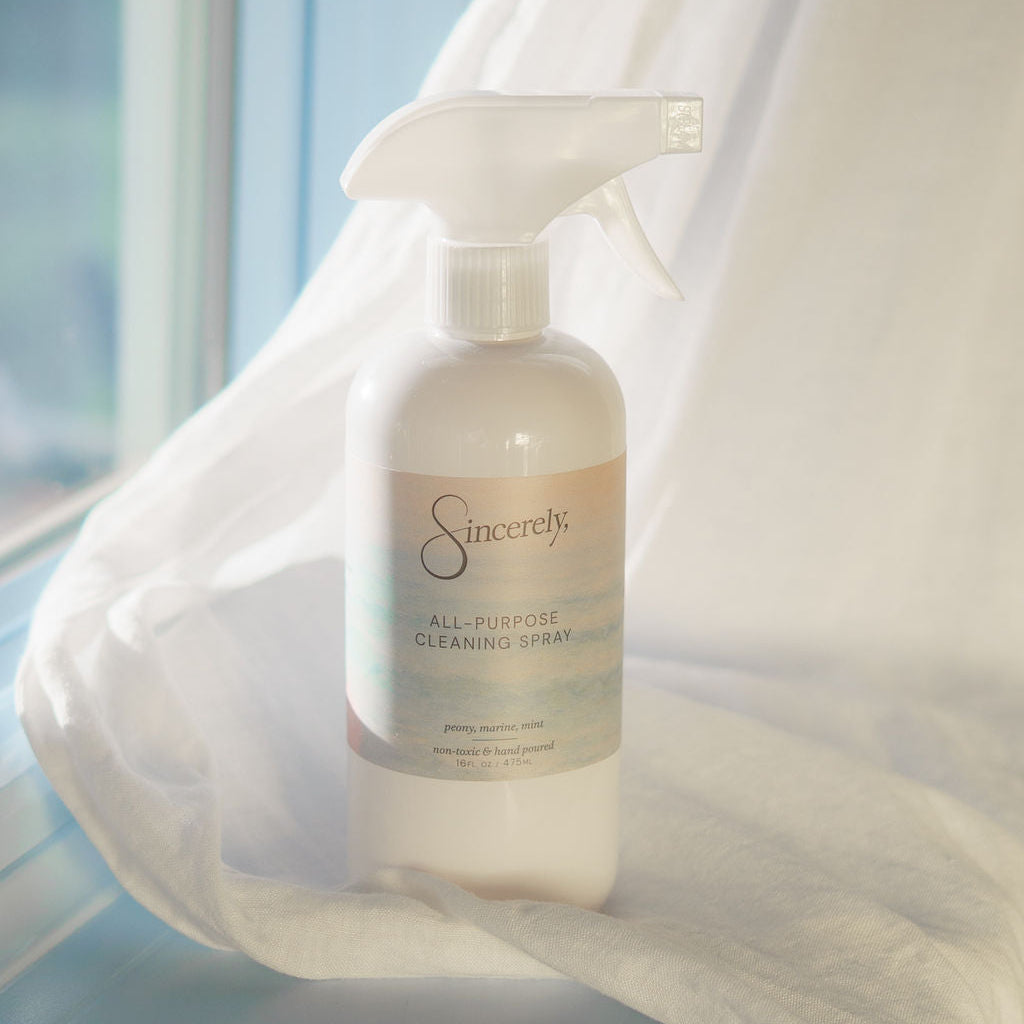 Sincerely all purpose cleaning spray bottle on a white surface with a blurred background