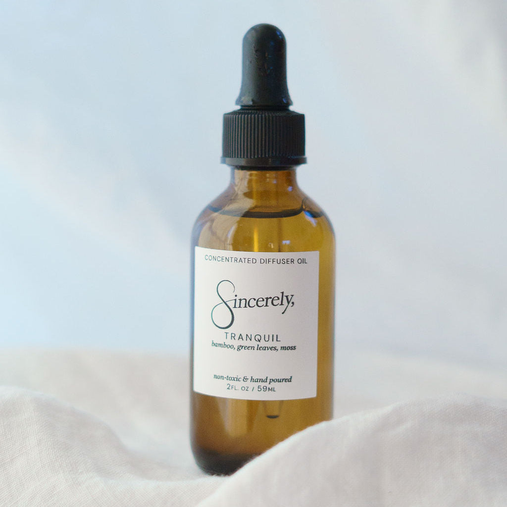 Bottle of 'Sincerely' tranquil oil on a light background