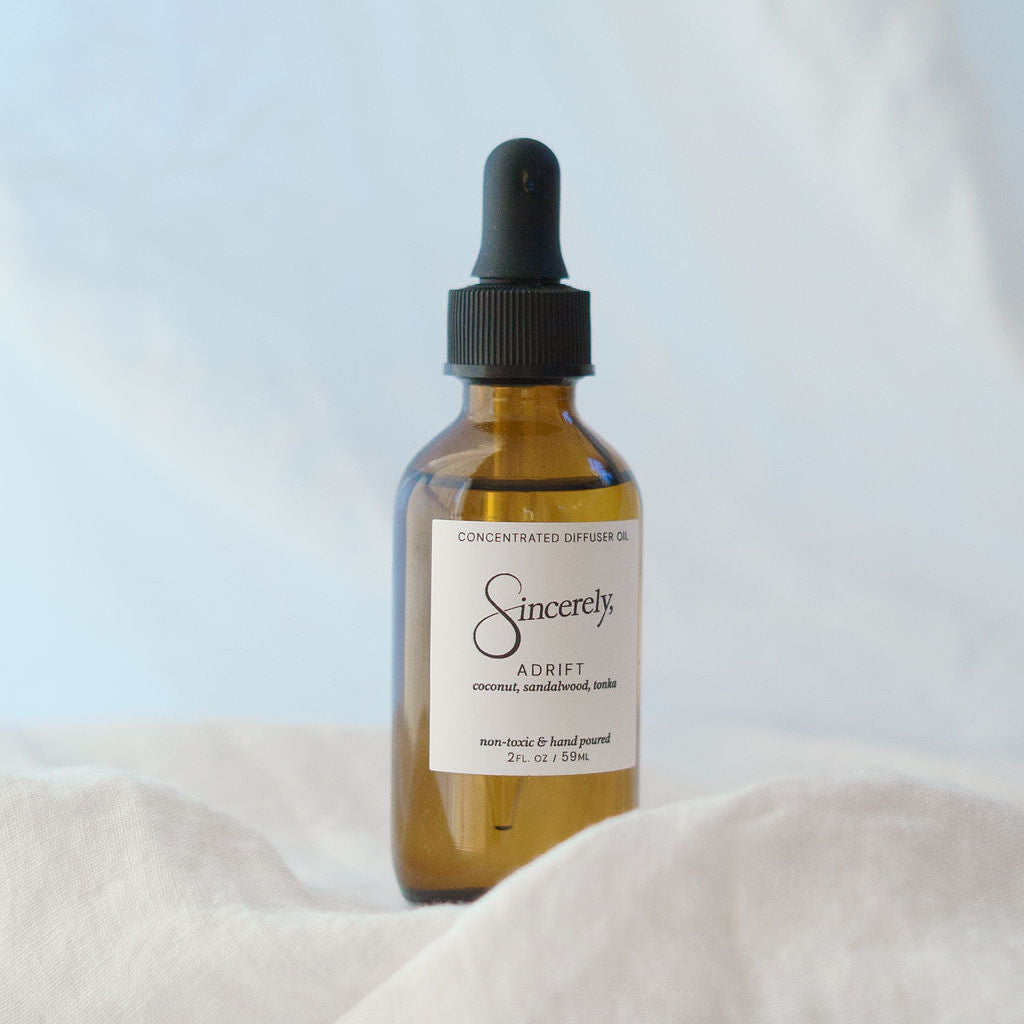 Amber glass dropper bottle labeled 'Sincerely' on a light background