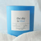 Blue candle labeled 'the sky is blue' on a white background