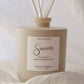 Reed diffuser labeled 'Sincerely' with 'Tranquil' fragrance on a soft white background