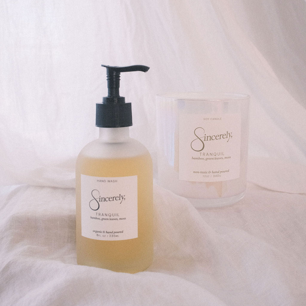 Bottle and jar of Sincerely products on a white fabric background